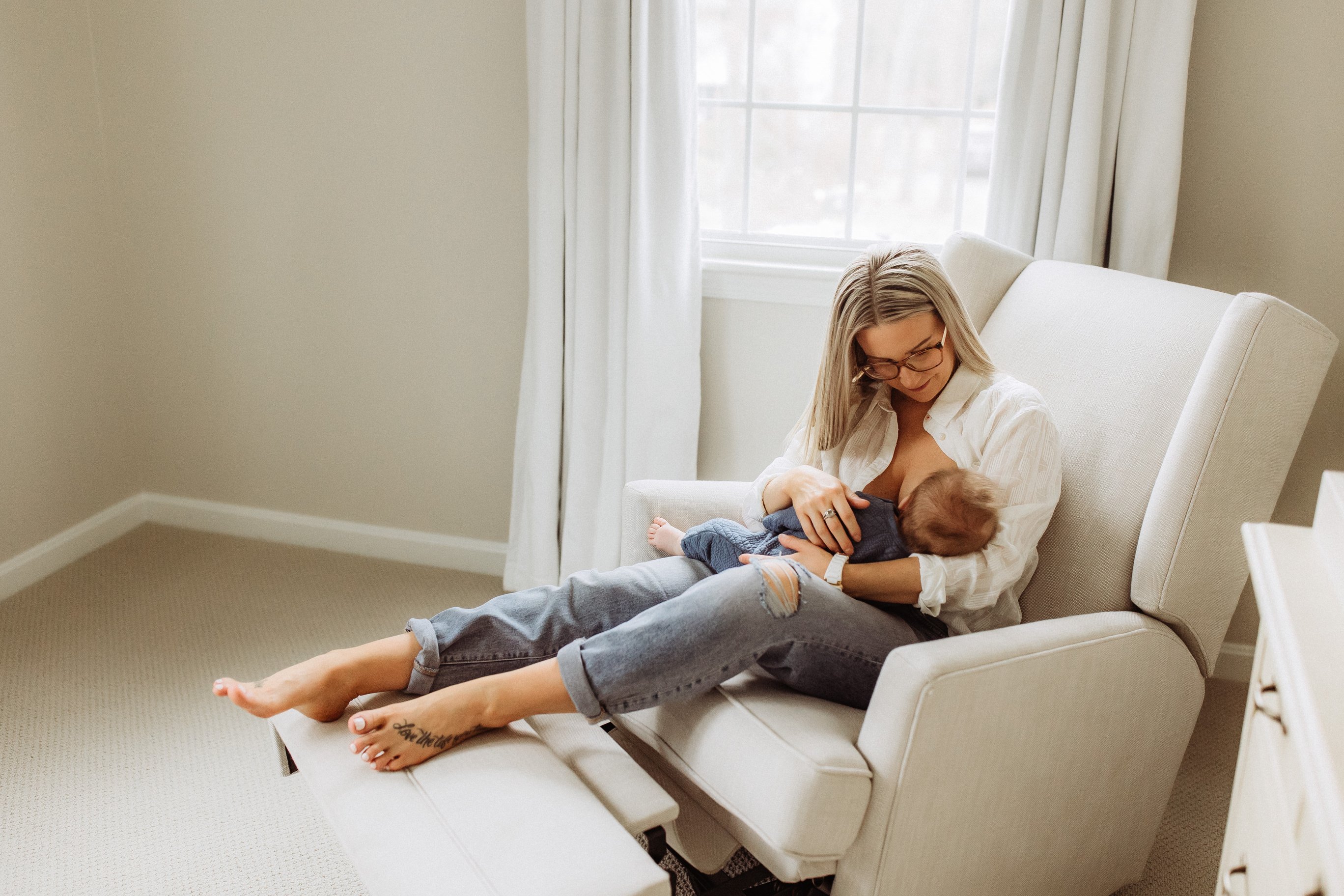 Mother Breastfeeding Son on an Armchair